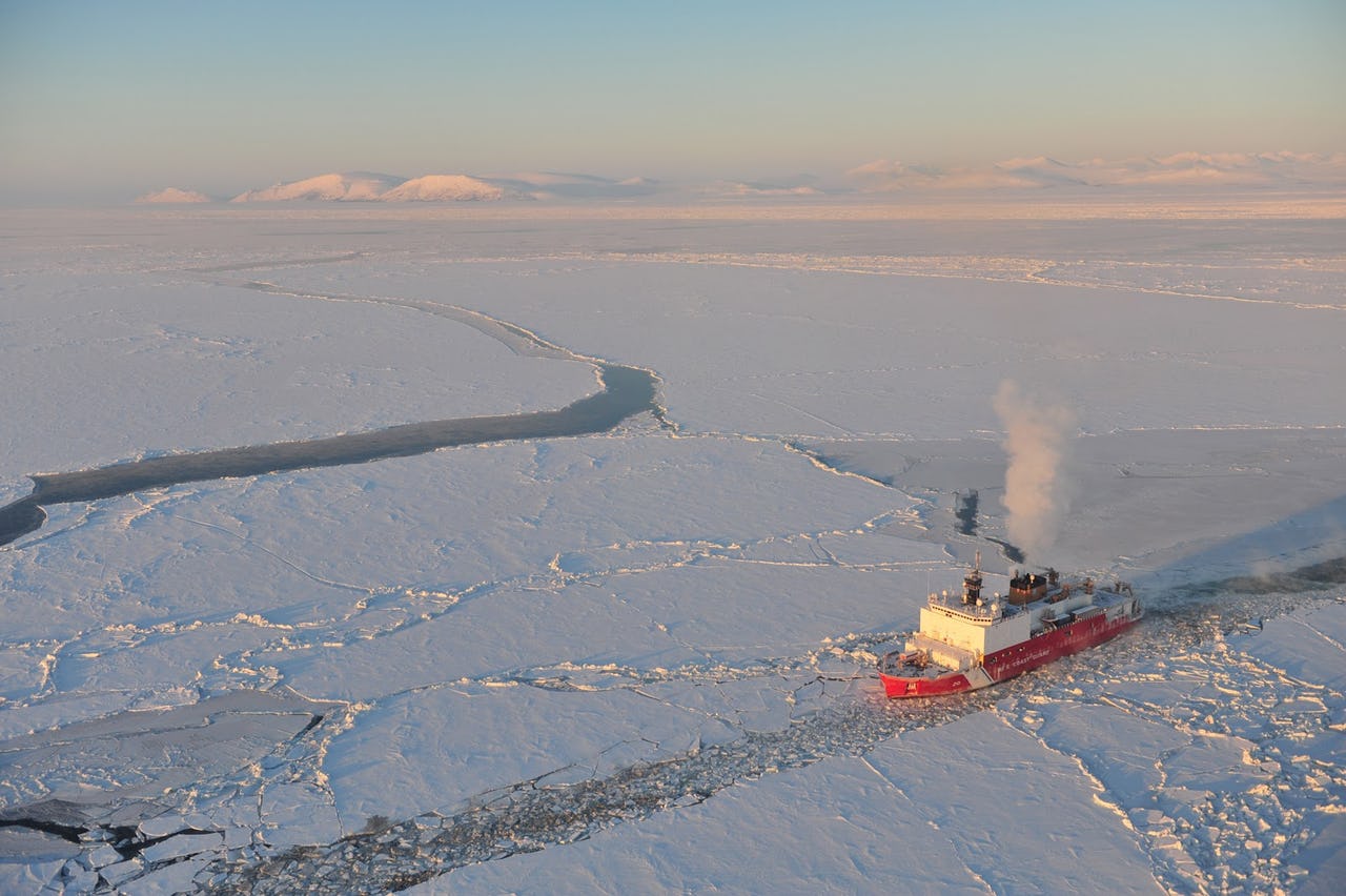 A U.S. Coast Guard icebreaker navigating through Arctic waters